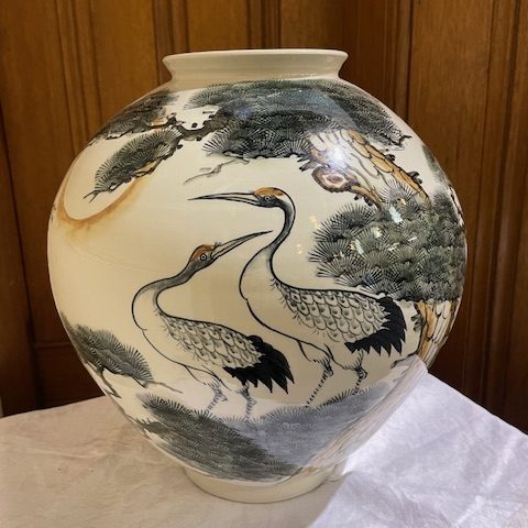 Korean vase showing crane birds and trees.